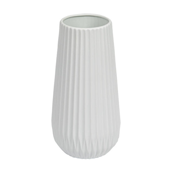 A tall white stoneware fluted vase with embossed lines.