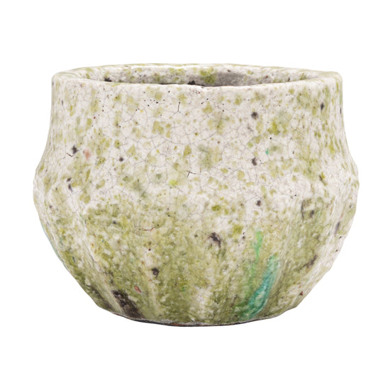 Textured green pot on a white background