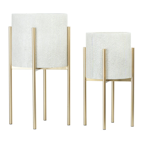 Two white textured planters with gold stands on a white background