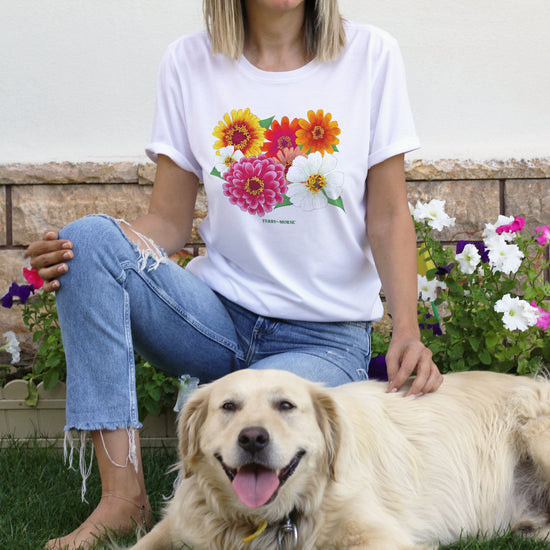 'Zinnia Lover' unisex T-shirt with a vibrant floral design, featuring zinnias in shades of pink, yellow, and red.