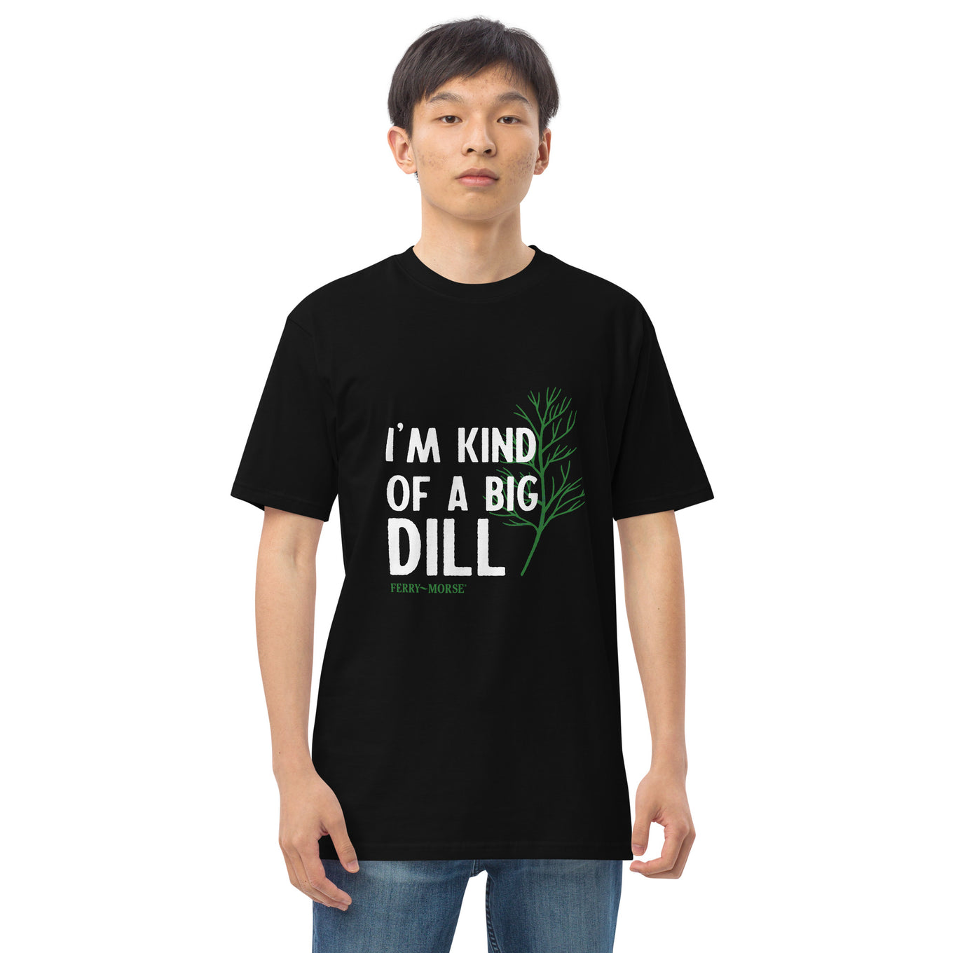 A person wearing a black unisex crew neck T-shirt with the text 'I'M KIND OF A BIG DILL' printed on the front.