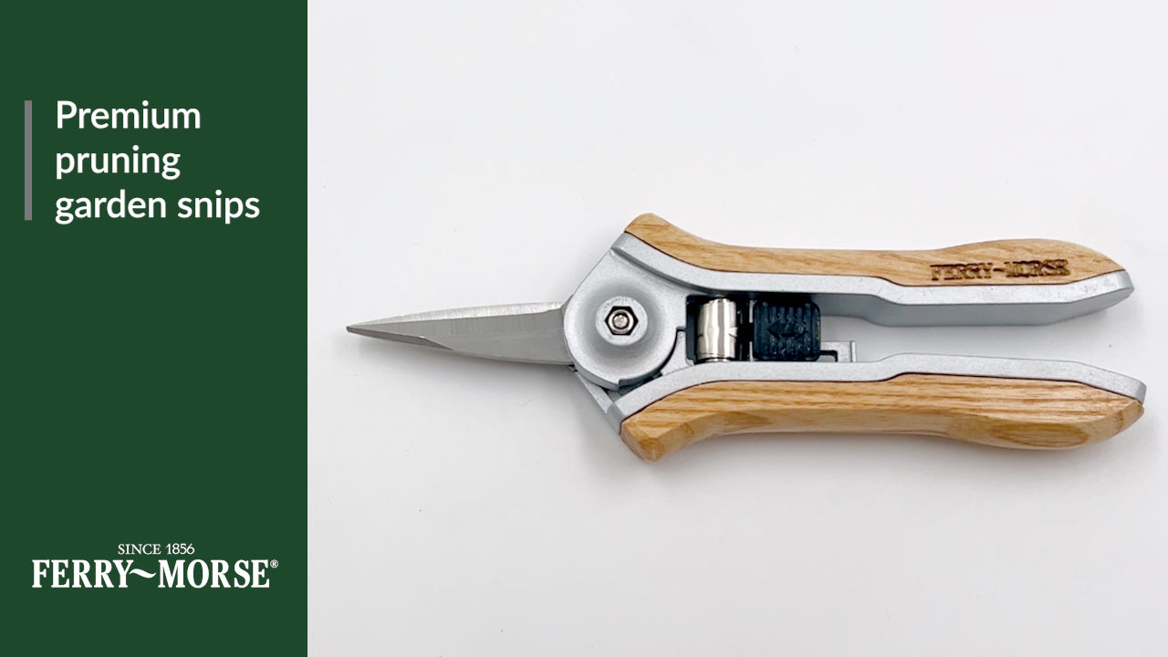 Premium pruning garden snips. Ash wood handle & stainless-steel blade. Smooth snipping action. Quick-release lock for fast, safe storage.