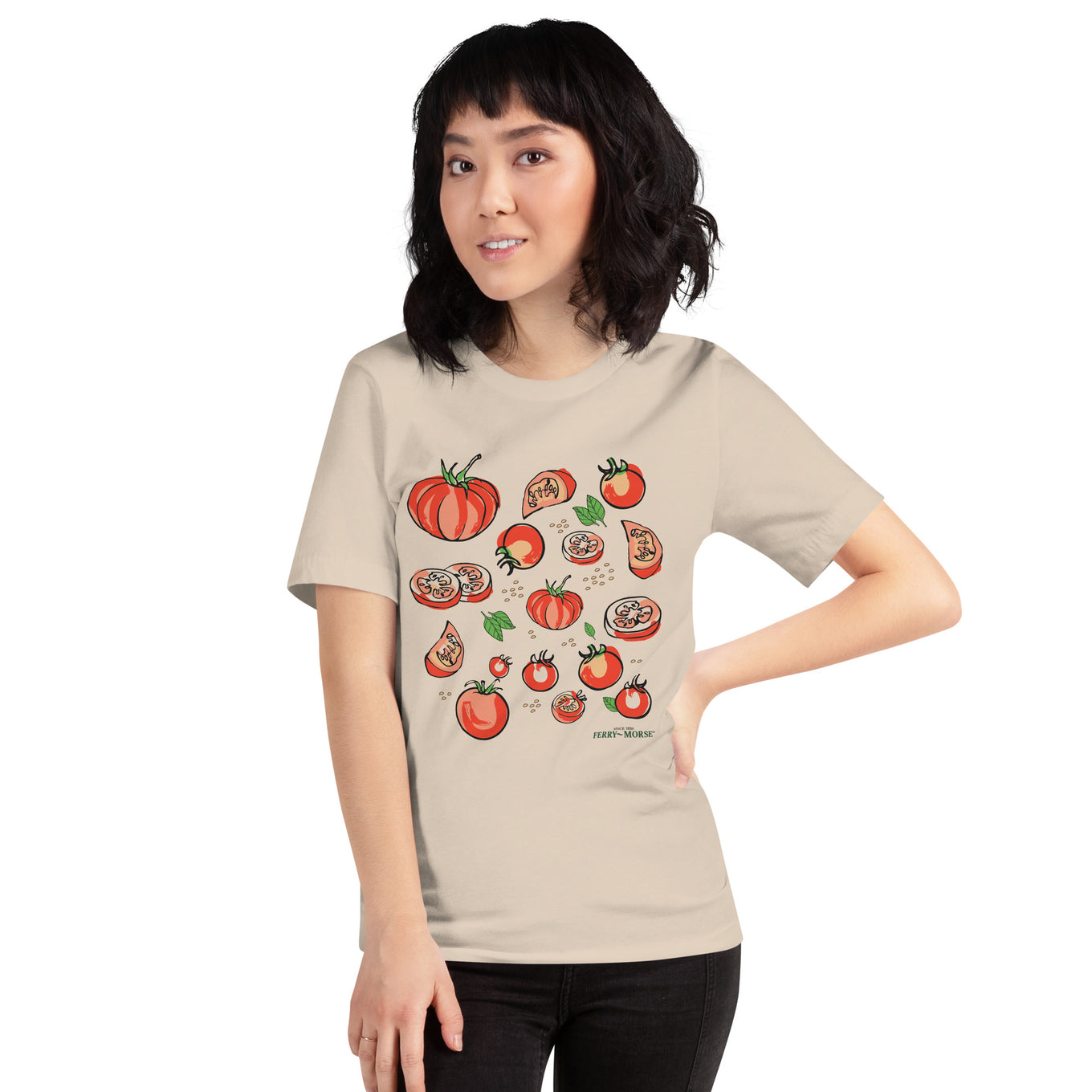 A woman wearing a beige 'Tomato Lover' t-shirt with a graphic of various tomatoes on it.