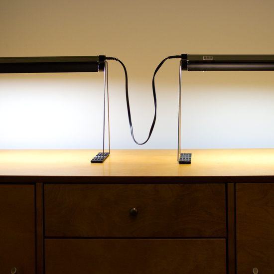 The indoor gardening Ferry-Morse grow light fixtures connected by one of our grow light fixture cords, in use.