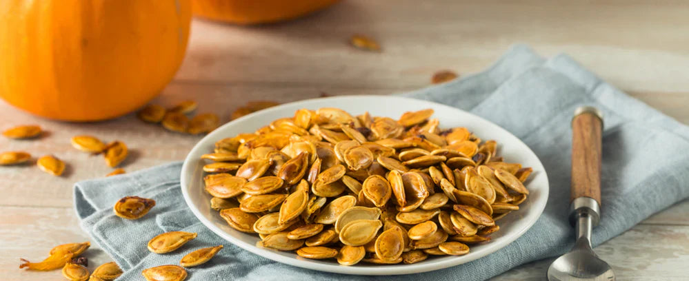 Roasted pumpkin seeds on a plate