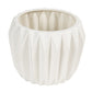 White textured ceramic pot on a white background