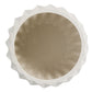 White ceramic pie dish with scalloped edge on a white background