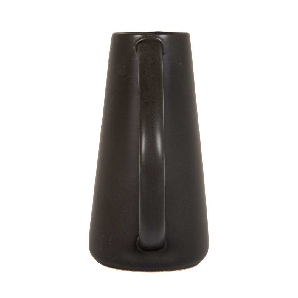 Black ceramic pitcher on a white background