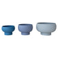 Three blue ceramic bowls of different sizes on a white background