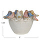 Decorative ceramic bowl with bird figurines on a white background