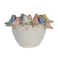 Decorative ceramic bowl with fish-shaped handles on a white background
