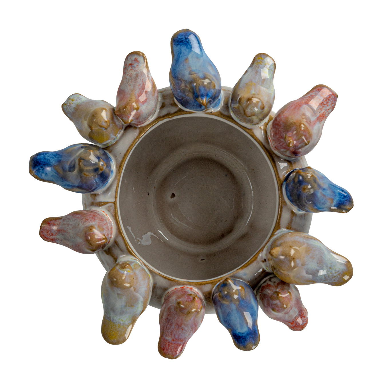 Ceramic candle holder with colorful bird-like figures on a white background