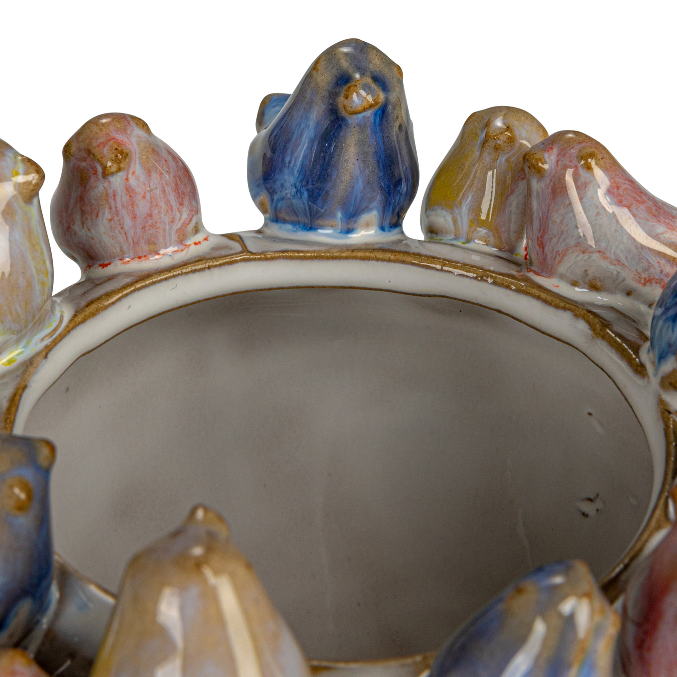 Close-up of a ceramic dish with decorative birds on a white background