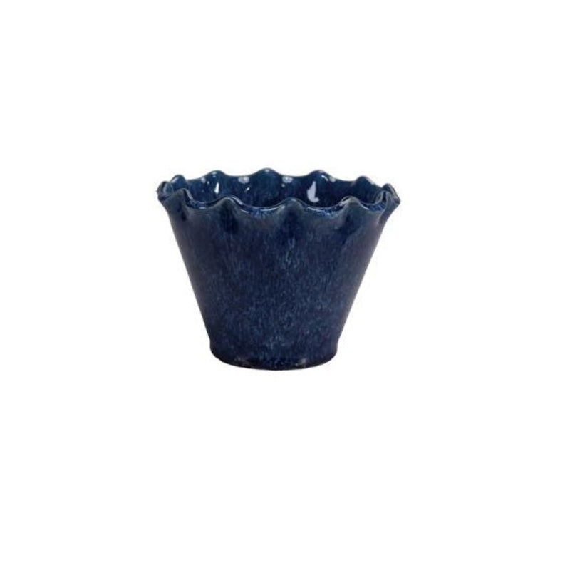 Navy blue ceramic cup with ruffled edge on a white background