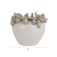 Stoneware planter with 3D snails on the rim and a reactive speckled glaze in blue, green, and cream finishes.