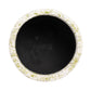 Round black stone with speckled beige rim on a white background