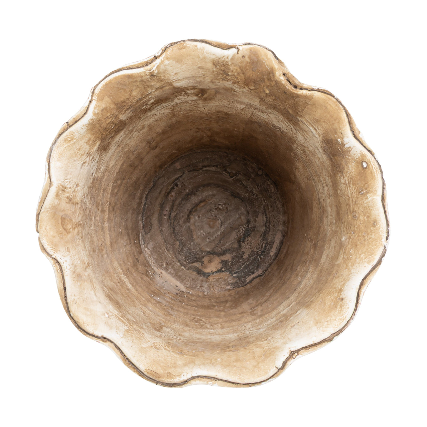 Top view of a Terracotta planter with a scalloped edge on a white background