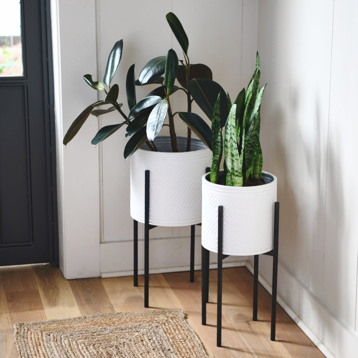 white plant pot with black stand Modern Boho Embossed Metal Planters with Stands