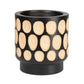 Black pot with beige circular patterns on a white background