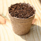 Add sowing medium to your peat pots, sowing medium not included.