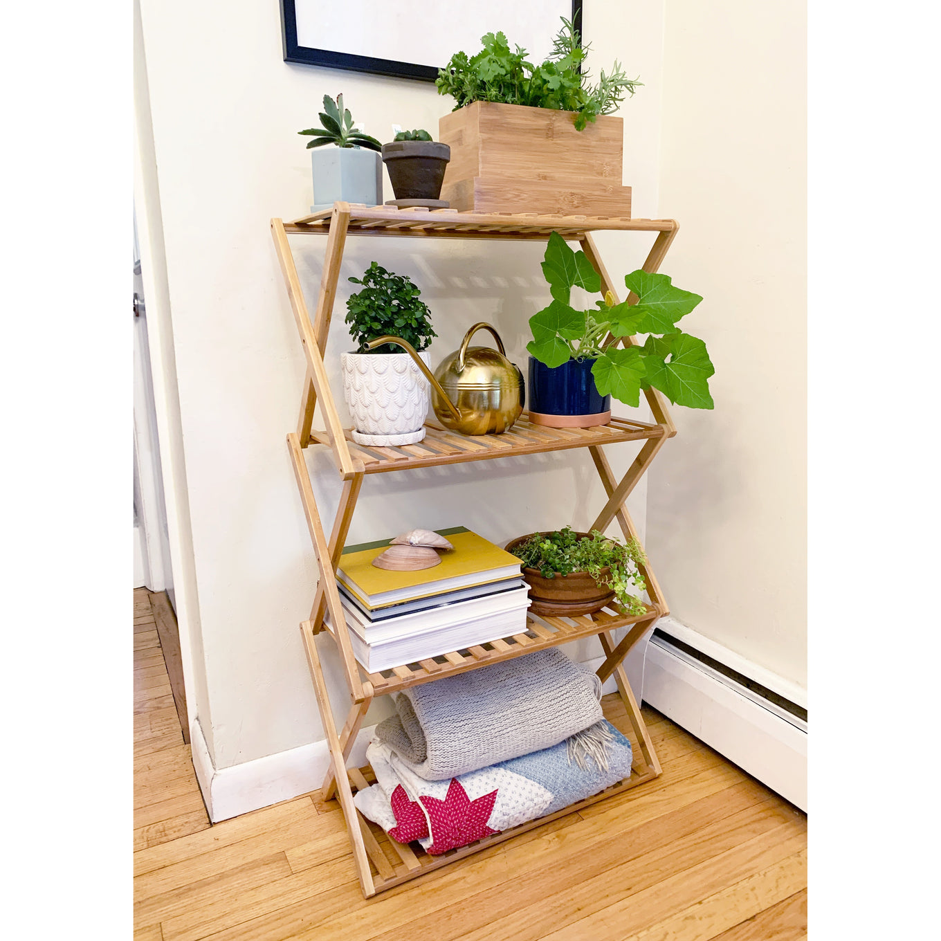 A multi-tiered indoor plant stand made of bamboo