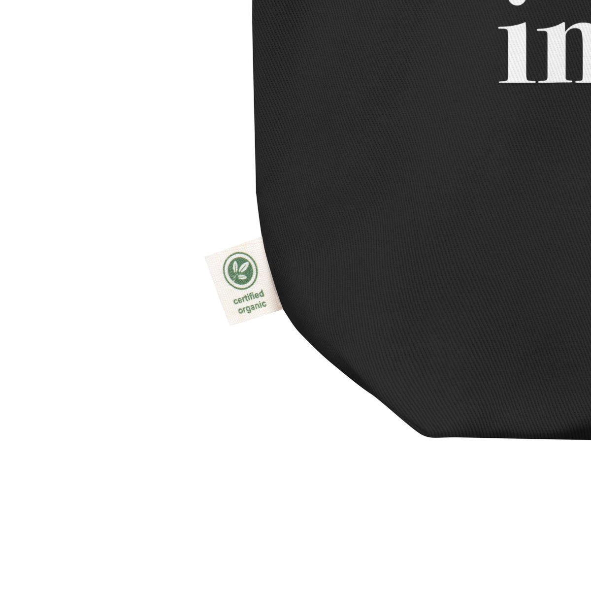 Black product with a certification label on a white background