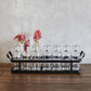 Seven Glass Bottle Vases on Rectangular Metal Tray